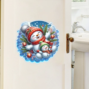 Detailed view of festive snowman wall stickers applied to a white door for Christmas decor