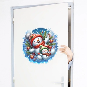 Detailed view of round Christmas snowman wall sticker applied on a white wooden door