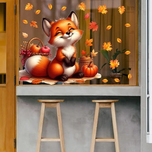 Close-up of a cute cartoon fox window sticker with autumn maple leaves and pumpkins