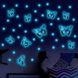 Glow in the dark blue butterfly wall stickers with fluorescent dots in a bedroom