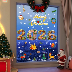 Close-up of 2026 gingerbread numbers and Santa motifs on Christmas window static stickers
