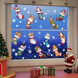 Detail of Christmas window stickers with Santa, Reindeer, and Snowman on glass window