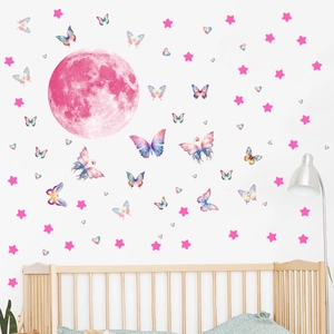 Detail of pink luminous moon and watercolor butterflies wall stickers in a nursery setting