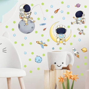 Cute astronaut and glowing space wall stickers for kids room with colorful planets and moon