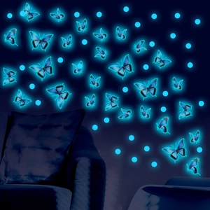 Glow in the dark butterfly wall stickers with dots emitting blue light in the dark