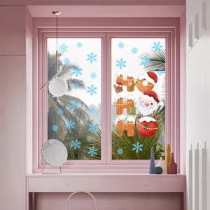 Detail of Christmas window stickers featuring Ho Ho Ho text with Santa and snowflakes