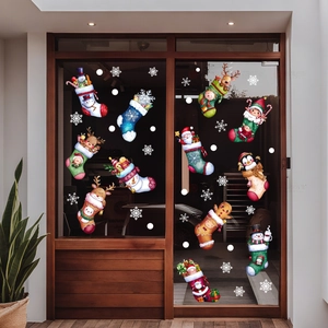Close-up of 12 Christmas stocking window stickers with Santa and reindeer on glass