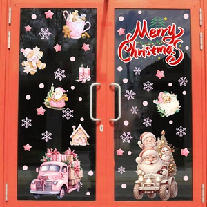 Détail de stickers de Noël roses en 3D pour porte vitrée avec Père Noël et flocons