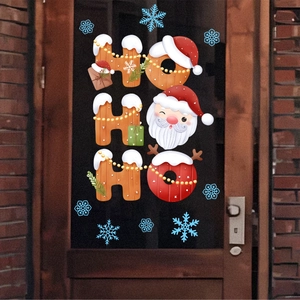 Christmas HO HO HO window stickers with Santa Claus and snowflakes on glass doors