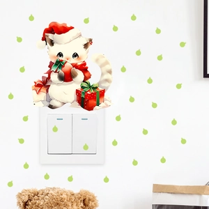 Christmas cat wall sticker with red gift boxes and green dots on a light switch panel