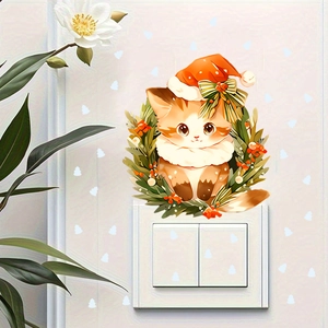 Detailed view of cartoon Christmas cat wall sticker on a light-colored switch box