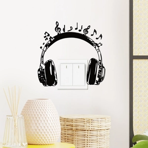 Creative headphone wall sticker with musical notes surrounding a dual light switch cover
