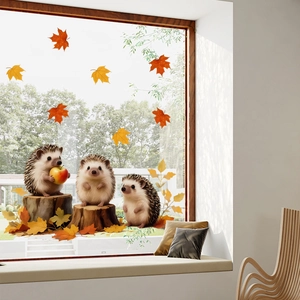 Detail of cute hedgehog and maple leaf static window clings for autumn decor