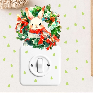 Detail of Christmas rabbit wreath and small tree glow stickers around light switch