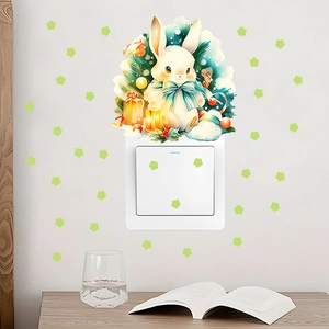 Detailed view of luminous Christmas rabbit wall sticker set applied on a light switch