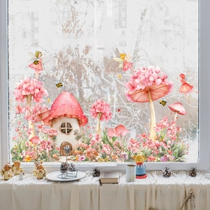 Detail of pink mushroom house and fairy window stickers on a glass surface with soft natural light