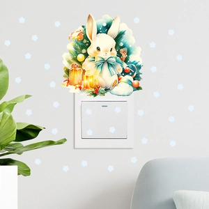 Detailed view of glowing cartoon rabbit wall stickers applied over a white light switch