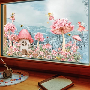 Detailed view of fairy house and mushroom window stickers with a snowy mountain view