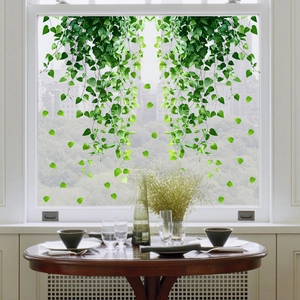 Detail of green leaf static window film showing realistic hanging plant patterns