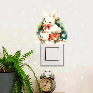 Cute cartoon white bunny wall sticker applied on a light switch panel for home decor