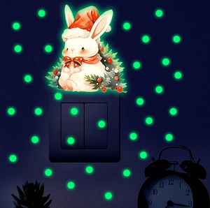 Glow-in-the-dark Christmas bunny wall sticker with luminous green dots for light switch decor