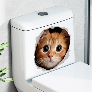 Detail of 3D orange cat wall sticker with a creative broken wall effect on a toilet tank