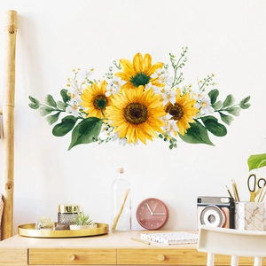 Detail of vibrant sunflower wall stickers on a white wall above a wooden desk