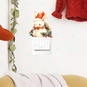 Christmas bunny wall sticker with Santa hat decorating a light switch panel