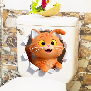 Detail showing a 3D cartoon orange cat wall sticker with realistic torn paper effect on toilet