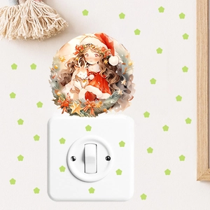 Close-up of glowing anime Christmas girl and reindeer wall sticker on bedroom switch