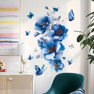 Dreamy blue floral and butterfly wall stickers for home decor on a white living room wall