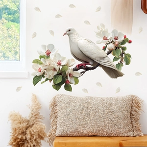 Detail of bird on flowering branch wall decal in a cozy living room decor