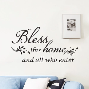 Minimalist 'Bless This Home' black vinyl wall decal with leaves for living room decor