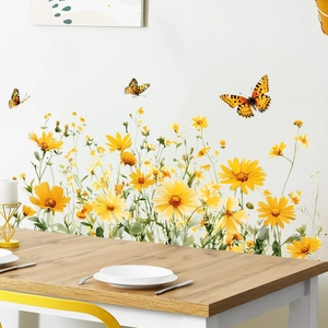 Detail of vivid yellow floral wall stickers with butterflies in a bright dining room