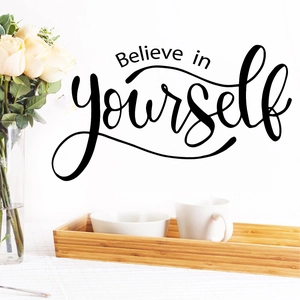 Believe in yourself wall decal with inspirational typography on minimalist white home wall