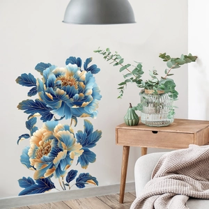 Detail view of blue and gold peony wall stickers in a minimalist bedroom setting