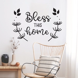 Detailed view of Bless THIS home wall decal with floral accents on a modern white wall