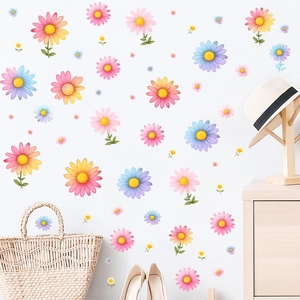 Detailed view of colorful watercolor daisy wall stickers in a bright minimalist bedroom