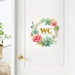 Floral WC toilet door sticker with succulents and gold text on white wooden door