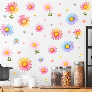Detail of colorful daisy wall decals applied to a white kitchen wall for home decoration