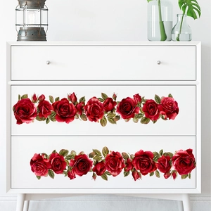 Self-adhesive red rose wall stickers applied to a white chest of drawers for home decor