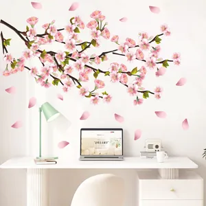 Detail of pink cherry blossom wall decal over a minimalist home office desk setup