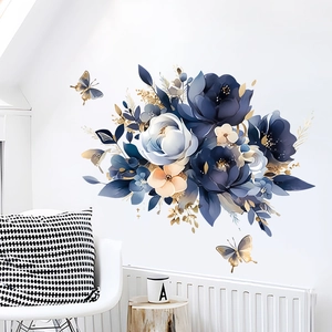 Blue floral wall stickers with watercolor flowers and gold lines in a Nordic bedroom set