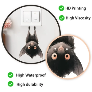 Detail of cute hanging bat wall sticker with orange eyes on high-quality waterproof PVC