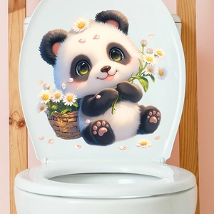 Close-up of cute panda with sunflower sticker applied on a white toilet lid in a cozy bathroom