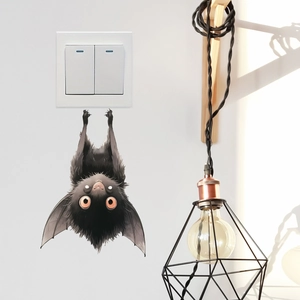 Cute black bat wall sticker with large orange eyes for home and switch decoration