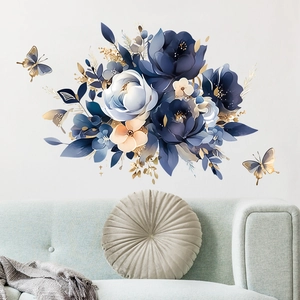 Elegant blue floral wall decals with butterflies above a modern sofa for home decor