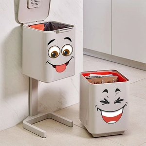 Modern white recycling bin set with funny cartoon face stickers for home waste sorting
