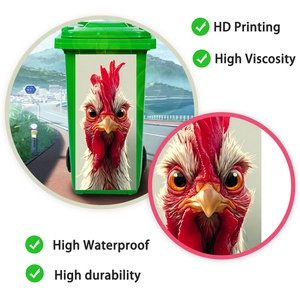 Macro detail of waterproof PVC rooster sticker applied on a green outdoor trash can
