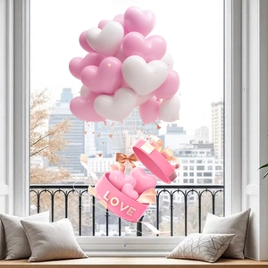Macro shot of a pink heart gift box with 3D LOVE lettering and floating heart balloons